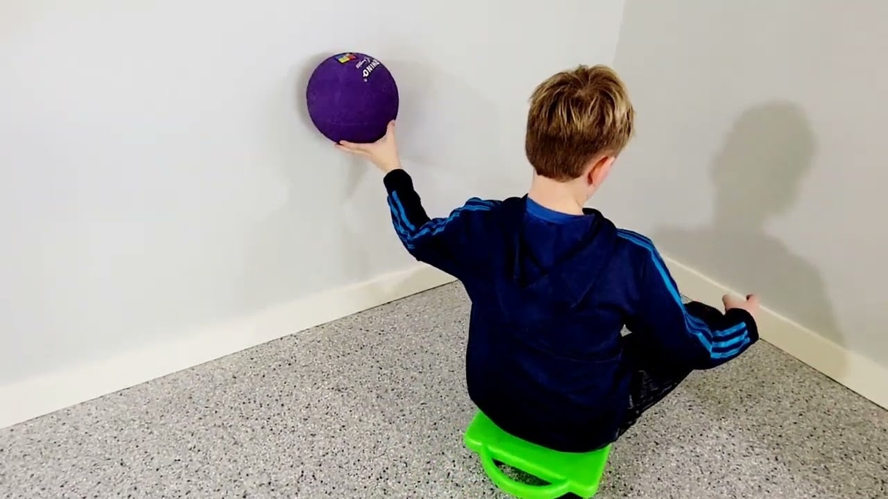 Scooter Board Ball on Wall Roll